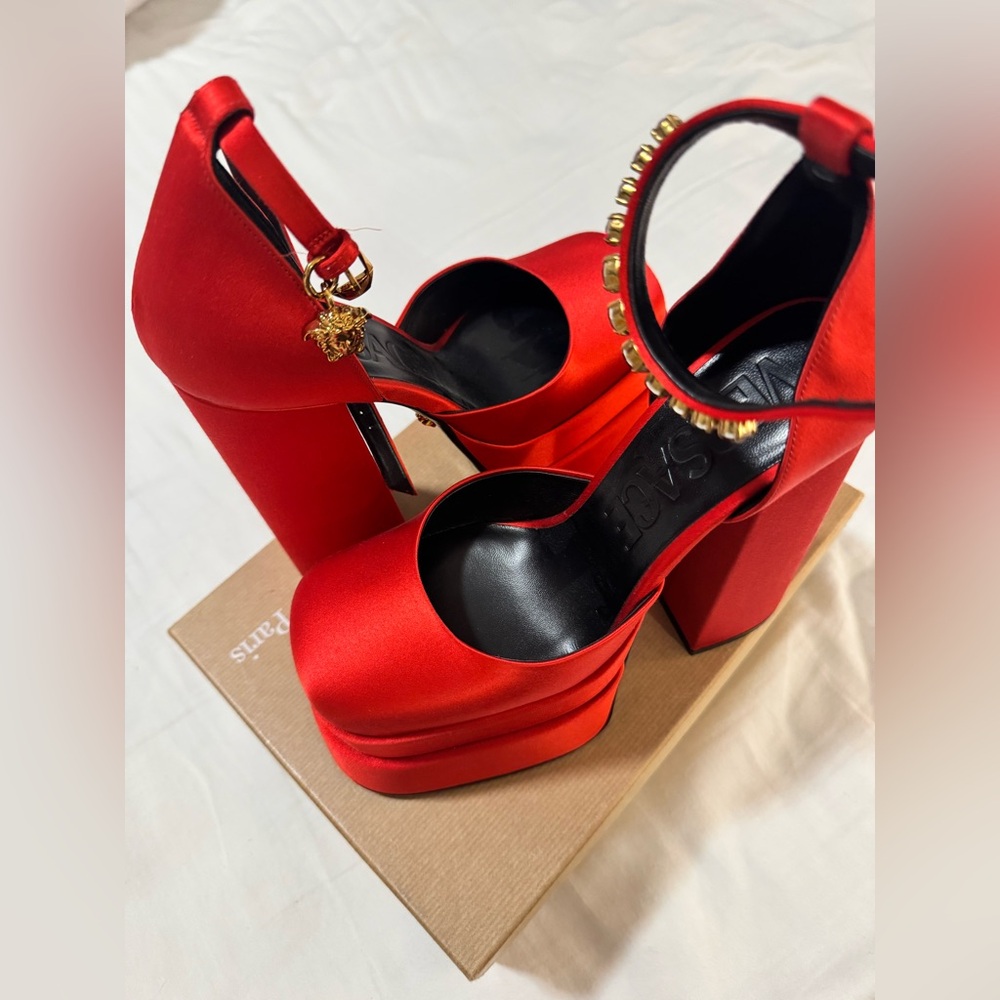 Versace 
Red Platform Heels with Gold Accents
Authentic never worn